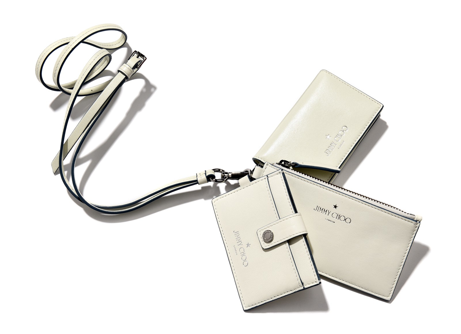 名刺入れ(上)W10.5×H6.5×D1.5cm 0万0000円、ミニウォレット(中)W14×H8×D1cm 0万0000円、カードケース(下)W10×H7×D1cm 0万000円、ネックストラップ0万0000円/すべてジミーチュウ