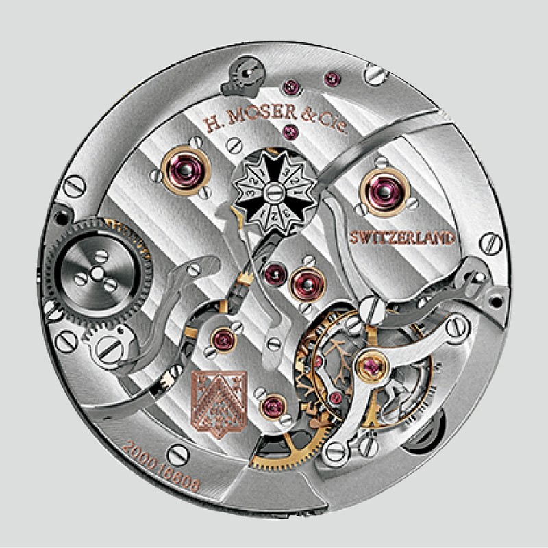 自社製のキャリバーHMC800は手巻き式ですが、パワーリザーブは約7日間。ムーブメントの裏側に閏年表示が収まるのも、このモデルの特徴です。